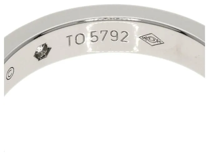 Anillo de platino con diamante 2P grabado Cartier 